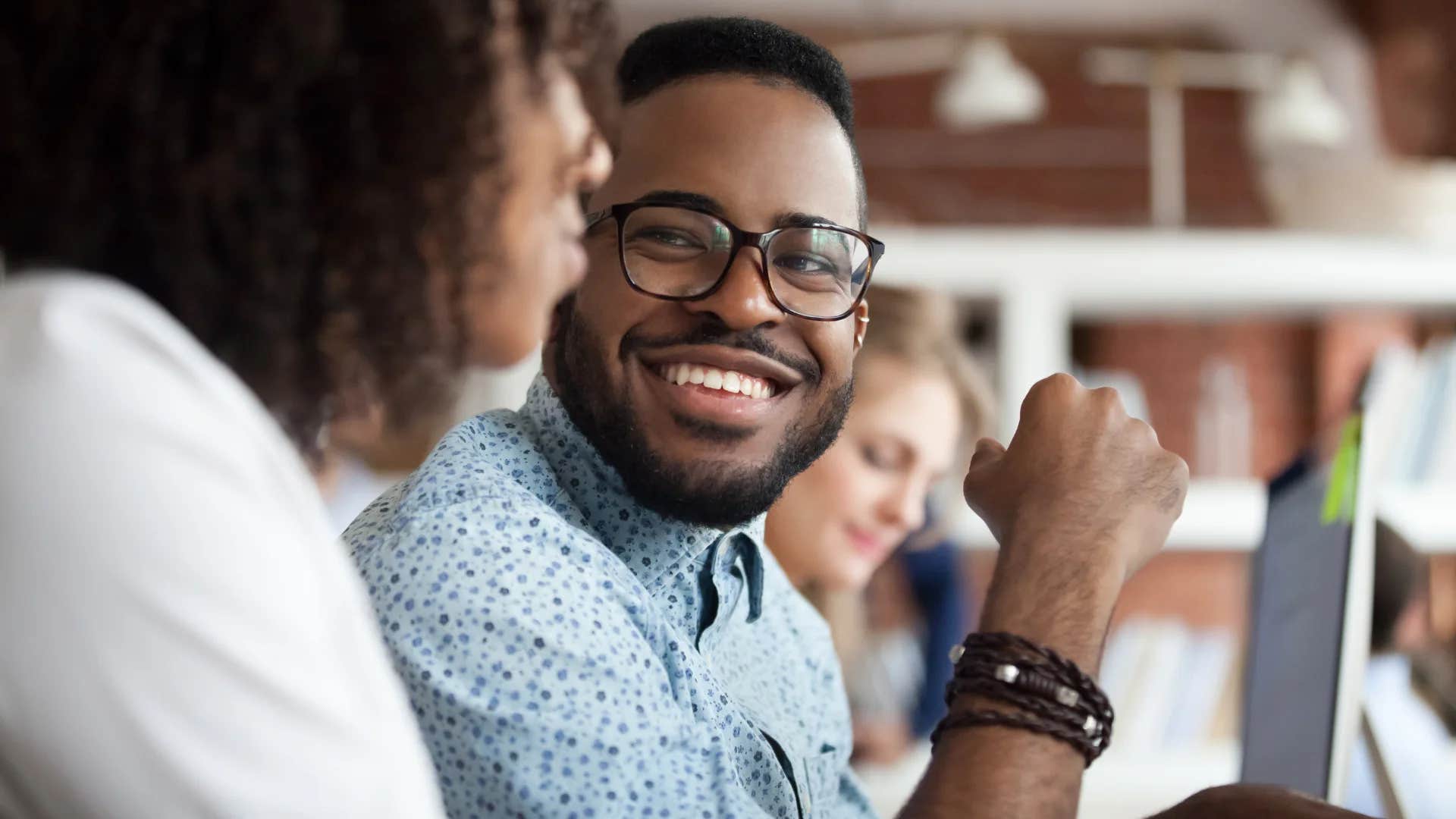 man talking to woman that's a good question
