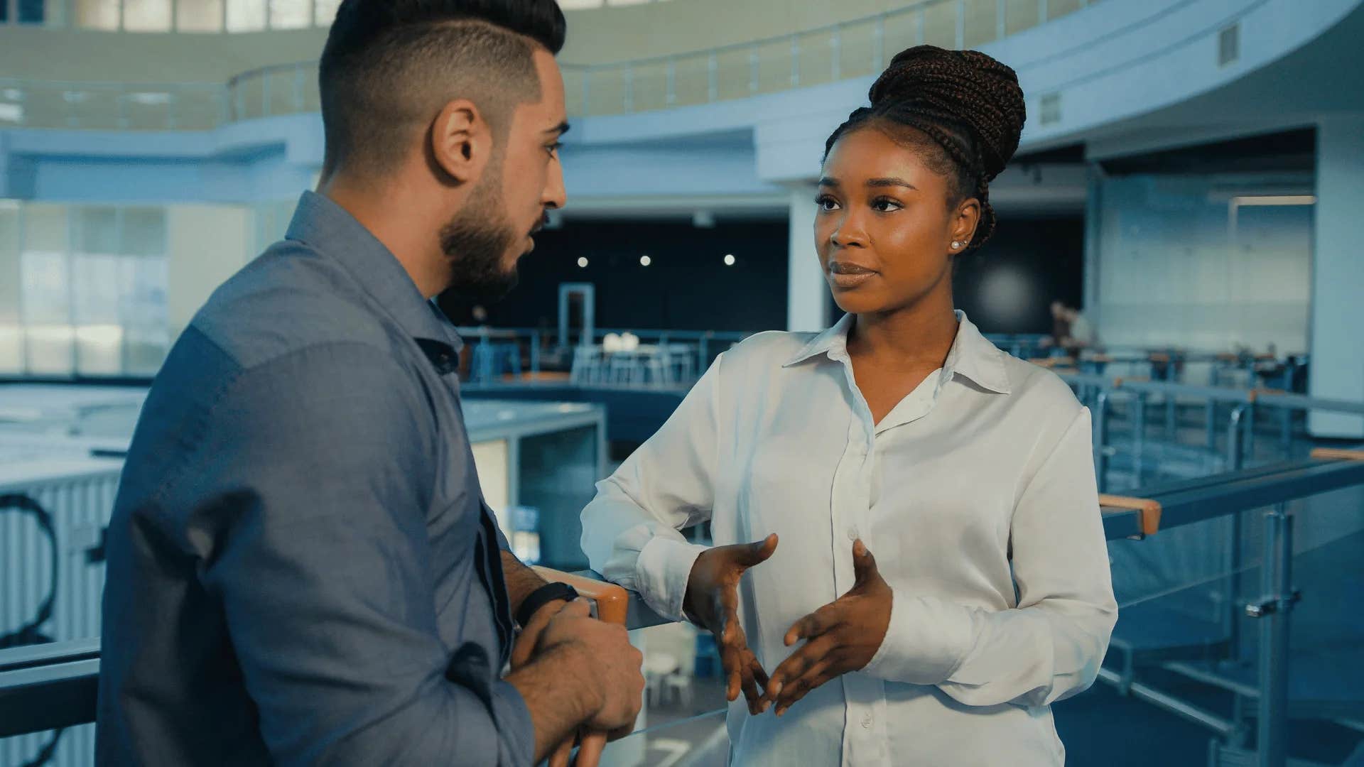 woman interrupting man saying hold on may i clarify something