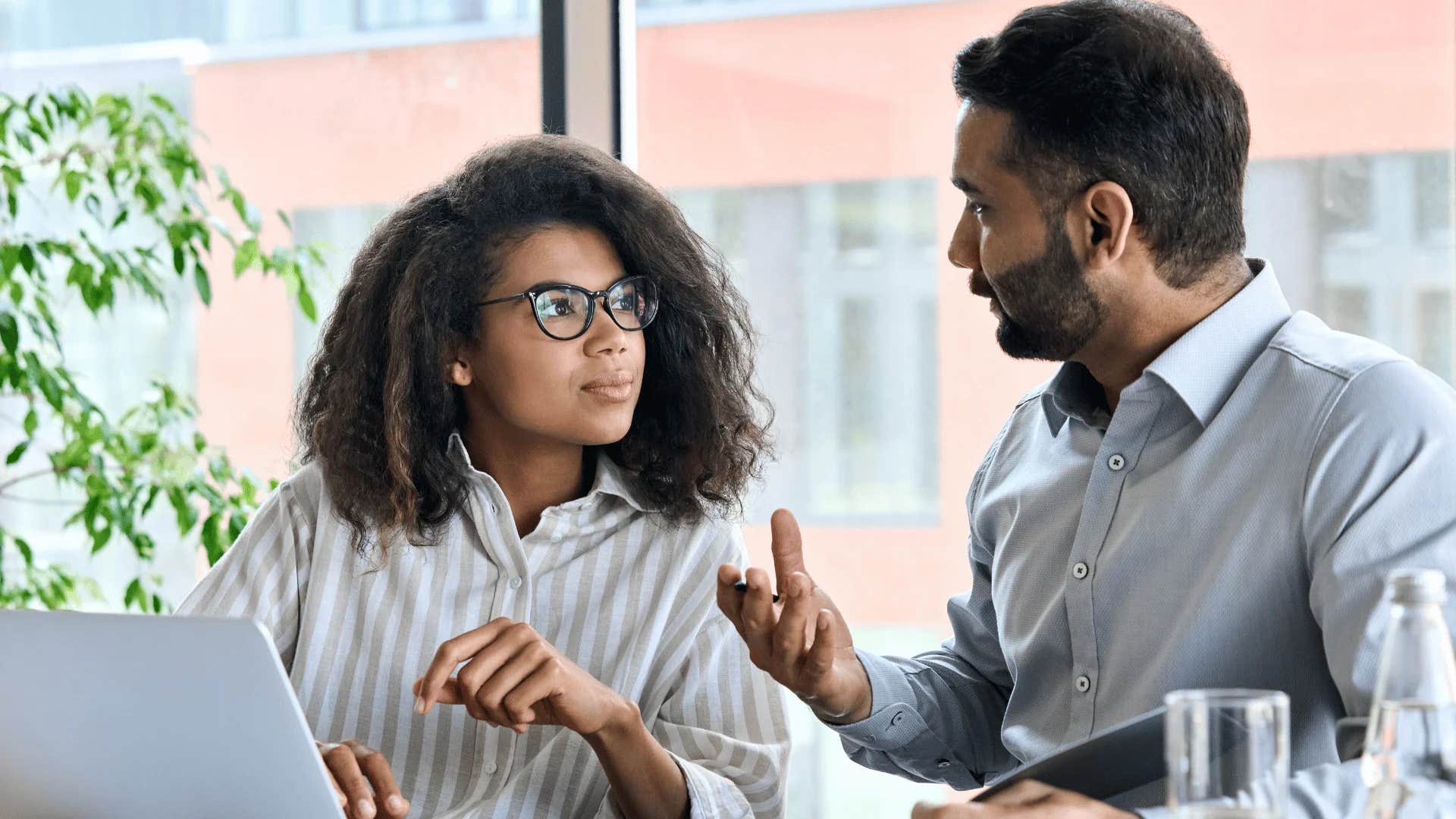 man telling young woman may i interrupt briefly