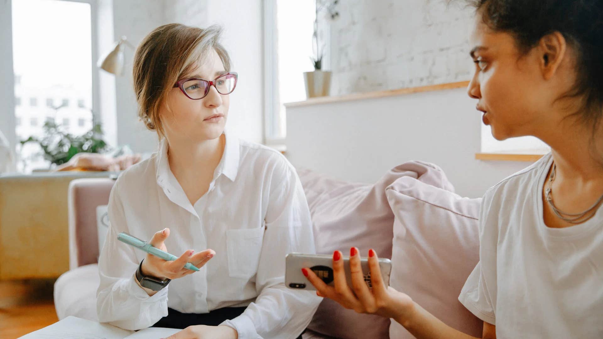 professional woman telling colleague i recommend speaking with