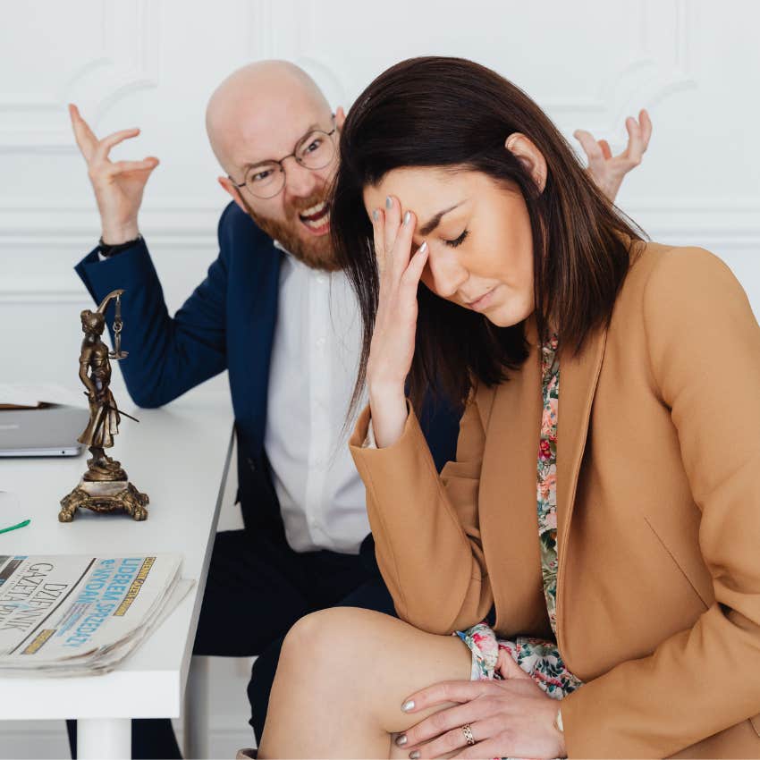 high-achieving employee sitting next to boss yelling at her