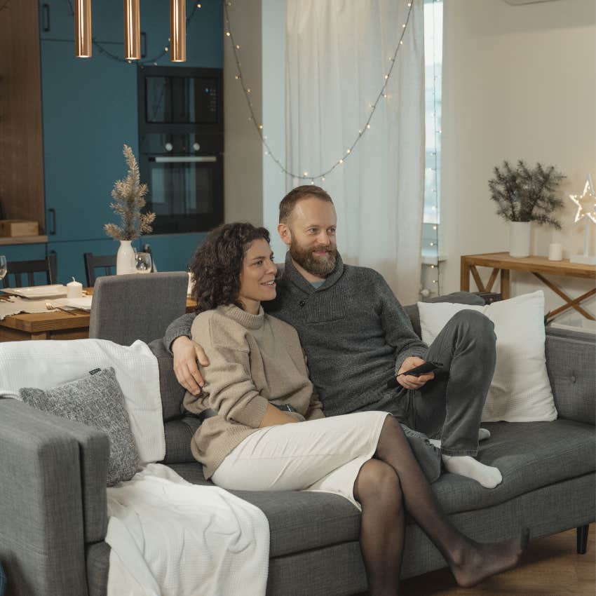 Long-term couple relaxing together at home and enjoying a simple shared activity without distractions
