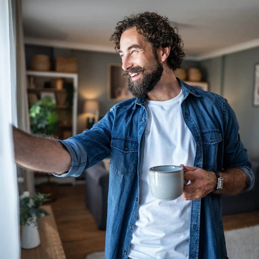 man who needs a lot of downtime to function enjoying his slow morning over coffee