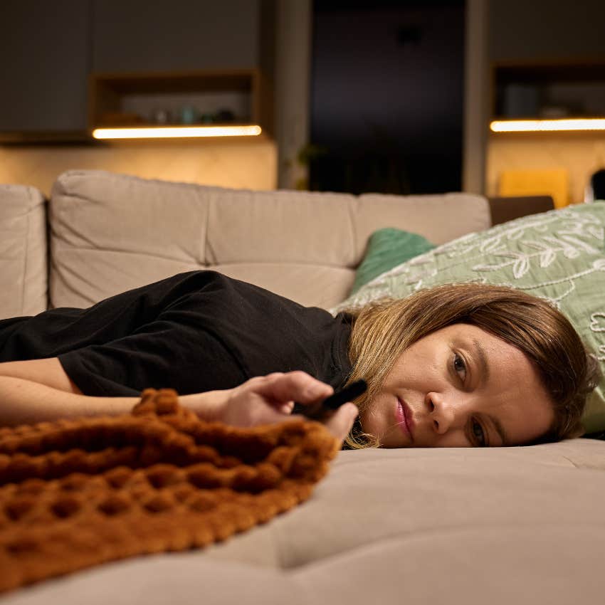 stressed overworked woman watching TV 