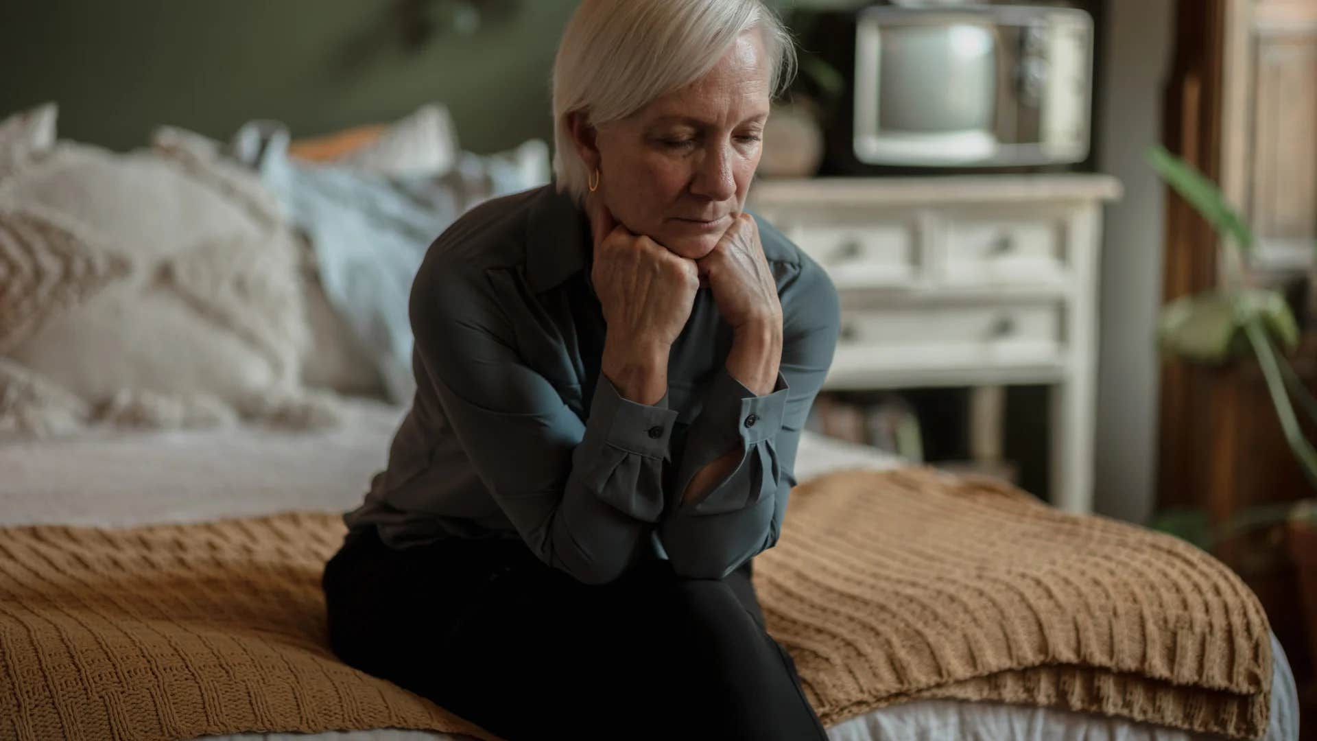 unhappy older woman saying it's too late for me
