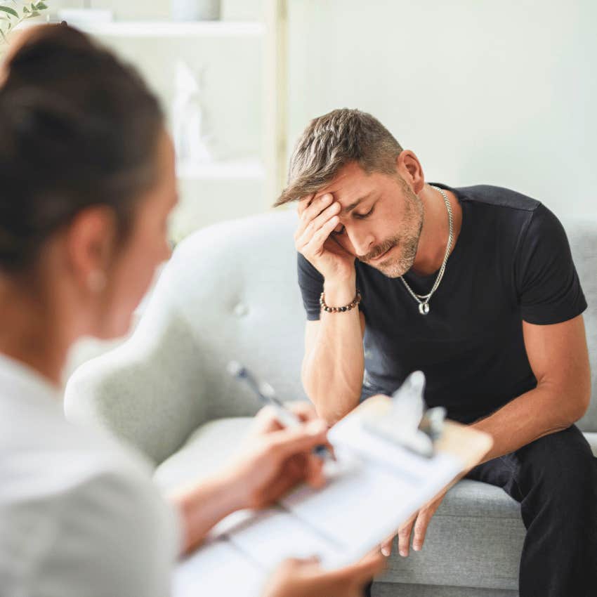 defeated man sitting in therapy