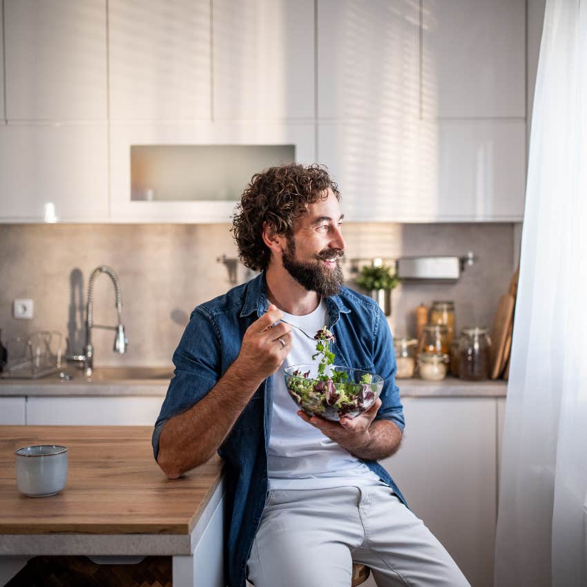 happy successful man eating without rushing