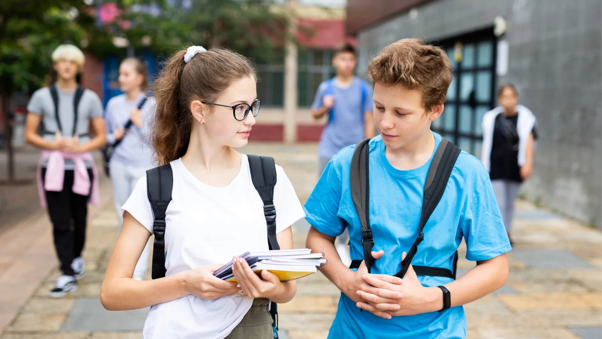 teenage boy asking teenage girl what's your name again