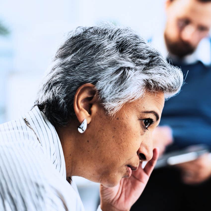 Intelligent woman looking exhausted around stubborn