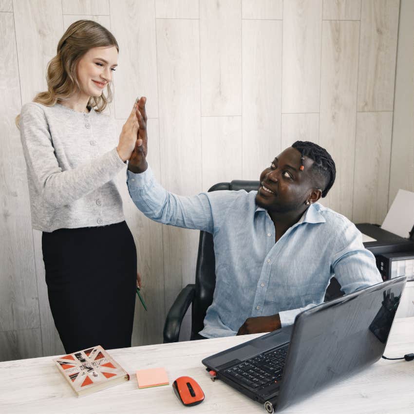 woman high-fiving confident friend for their achievements