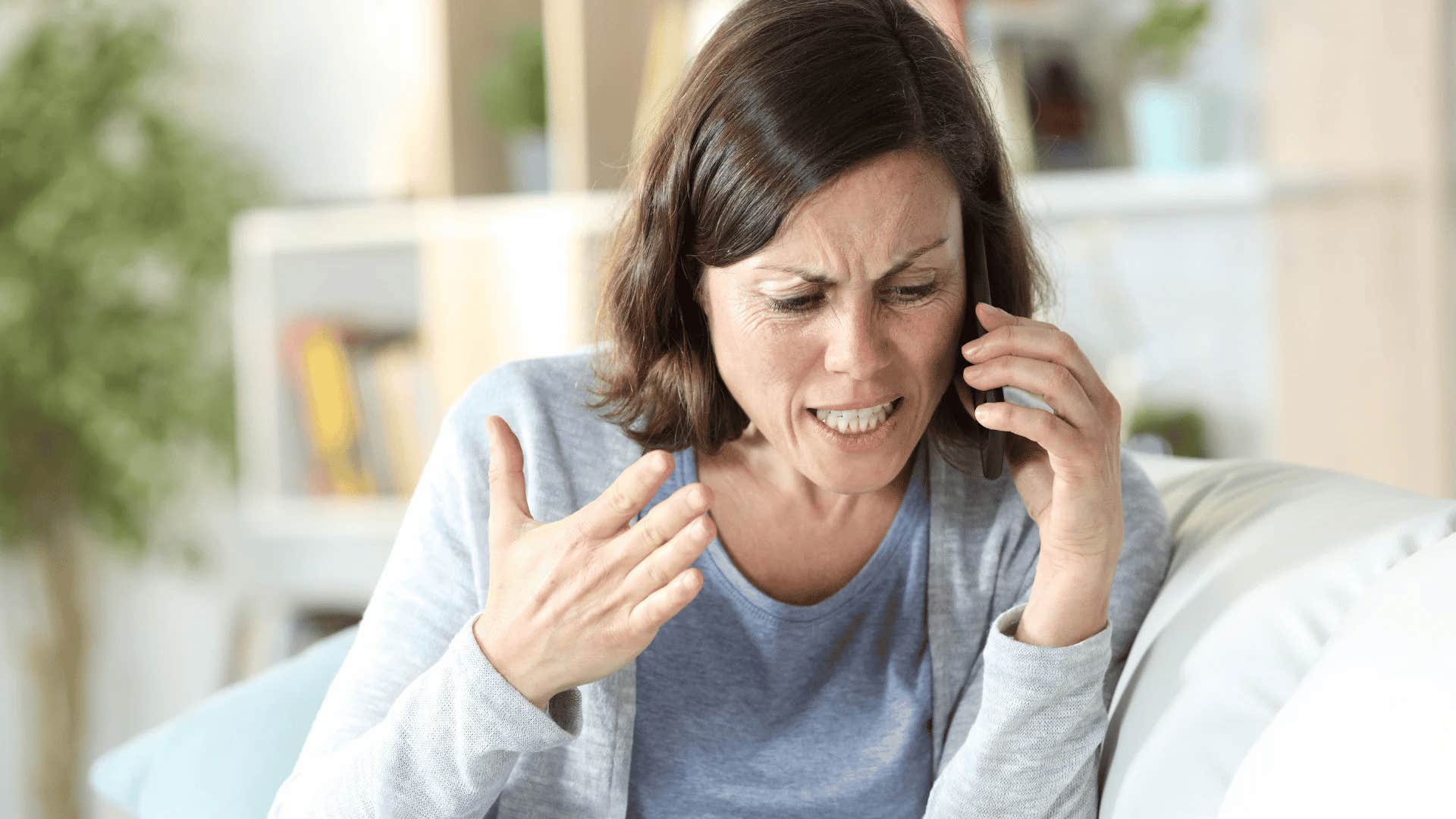 woman arguing on the phone with her parents
