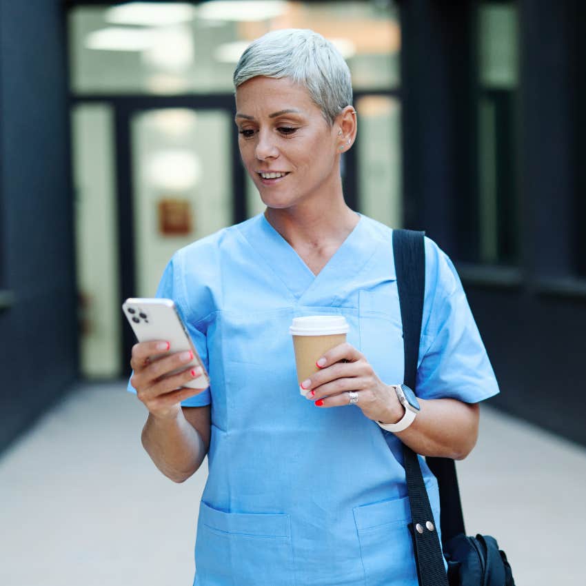 gen x woman being practical and dependable looking at phone