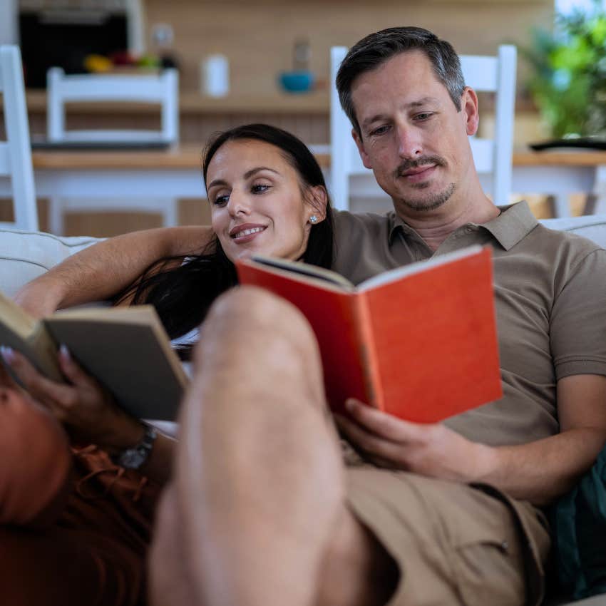 Gen Xers reading on the couch spending time alone together at home