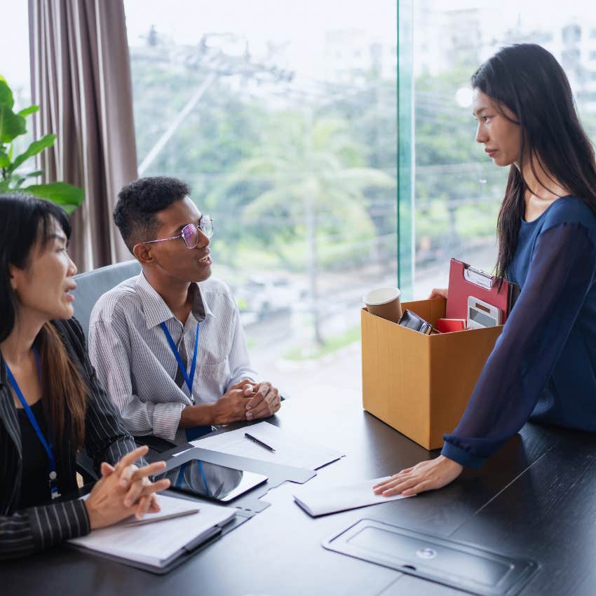 millennial woman talking to supervisors leaving her job