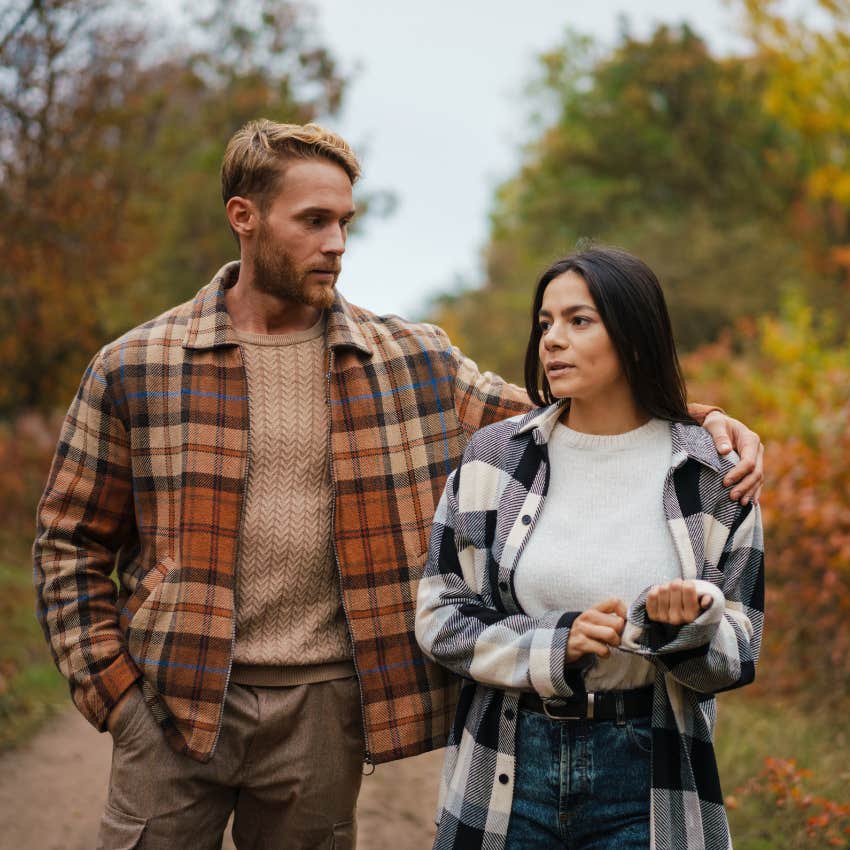 attractive man who is an amazing listener talking to woman on a walk