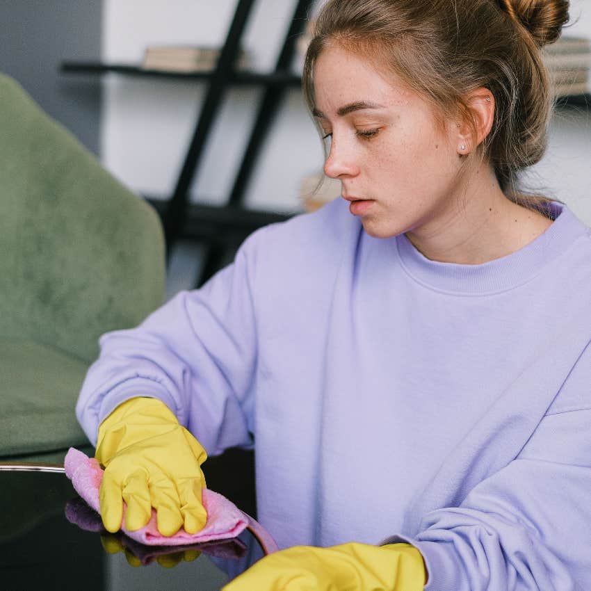 tidy woman cleaning her home's surfaces obsessively