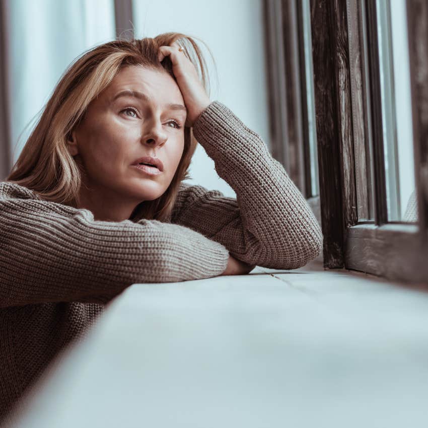 woman who tries to take up as little space as possible