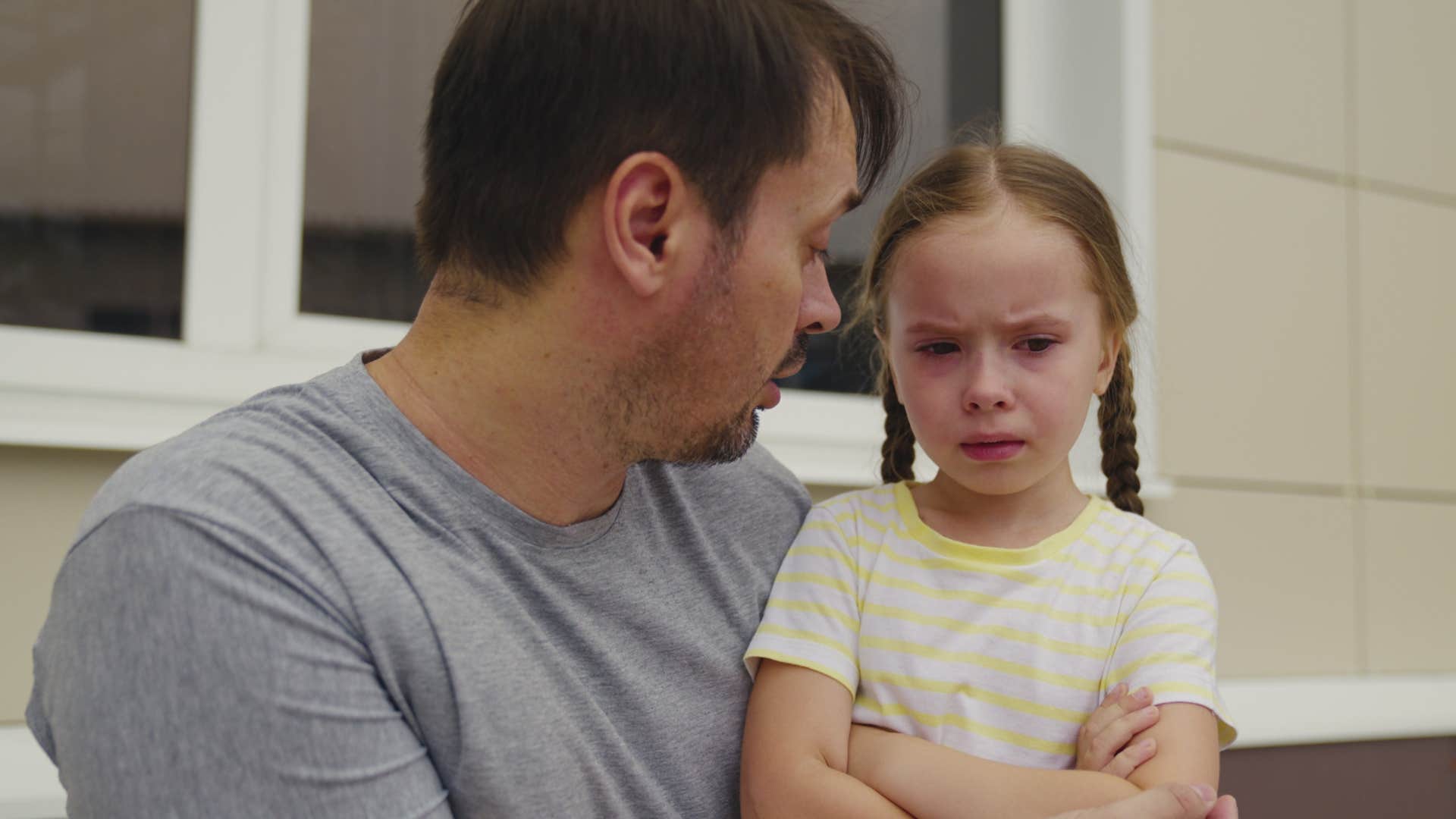 little girl apologizing when she doesn't need to because her dad won't admit fault