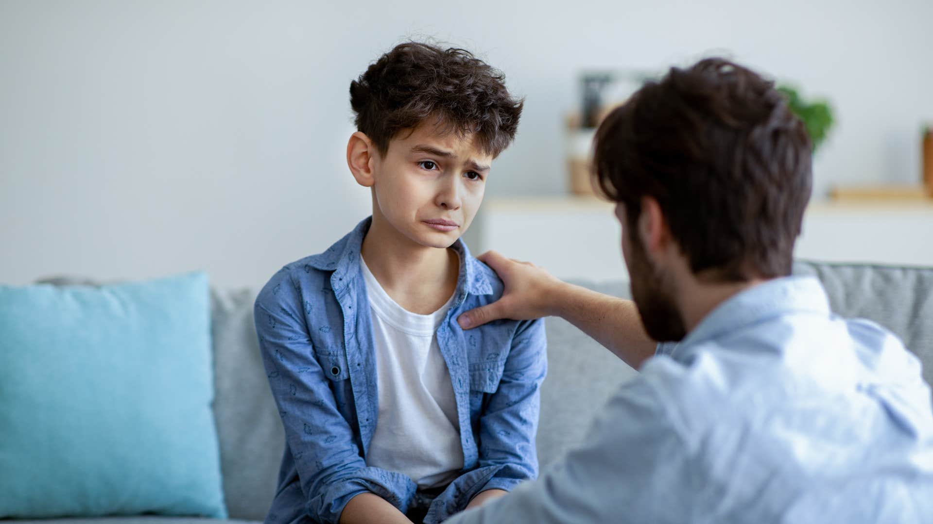 boy talking to his dad won't admit his own mistake because his parents never admit fault