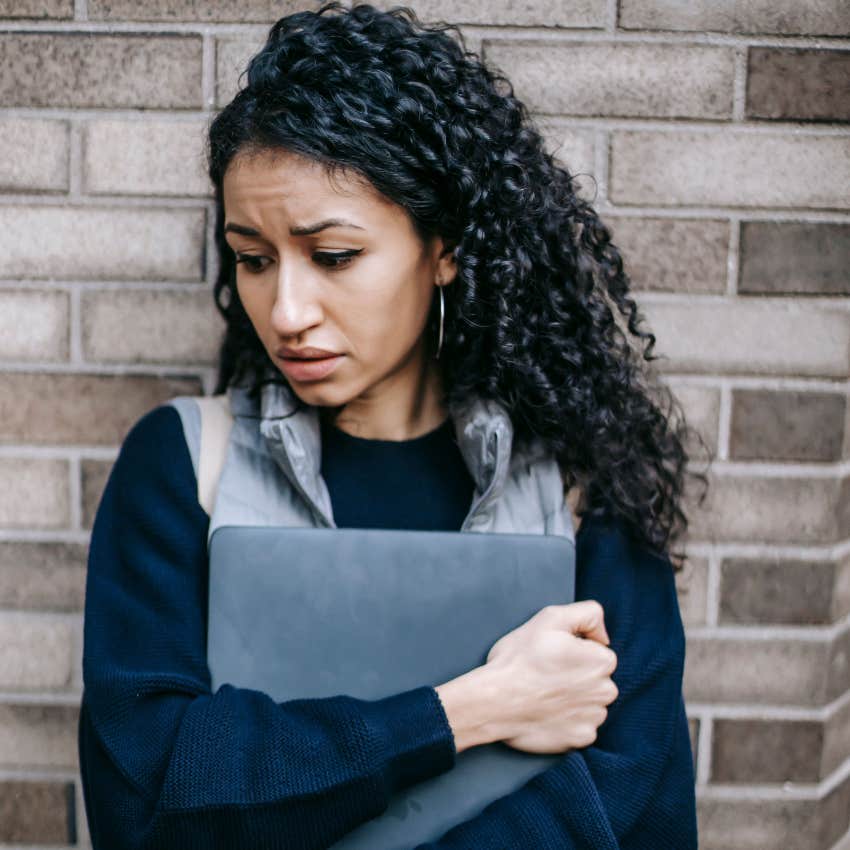sad worried woman unable to trust herself standing alone