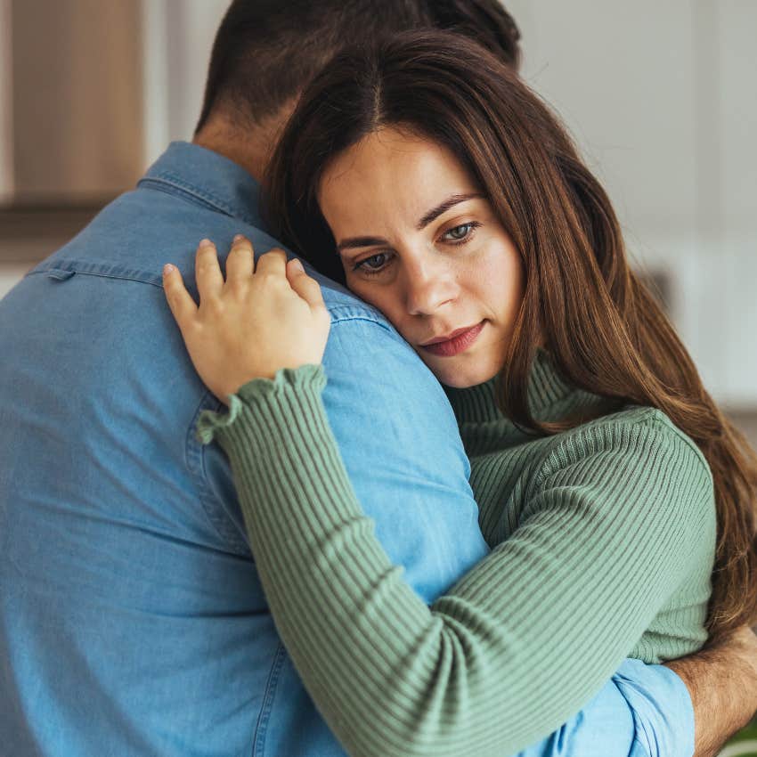 woman raised by single parent hugging husband because she can handle any problem