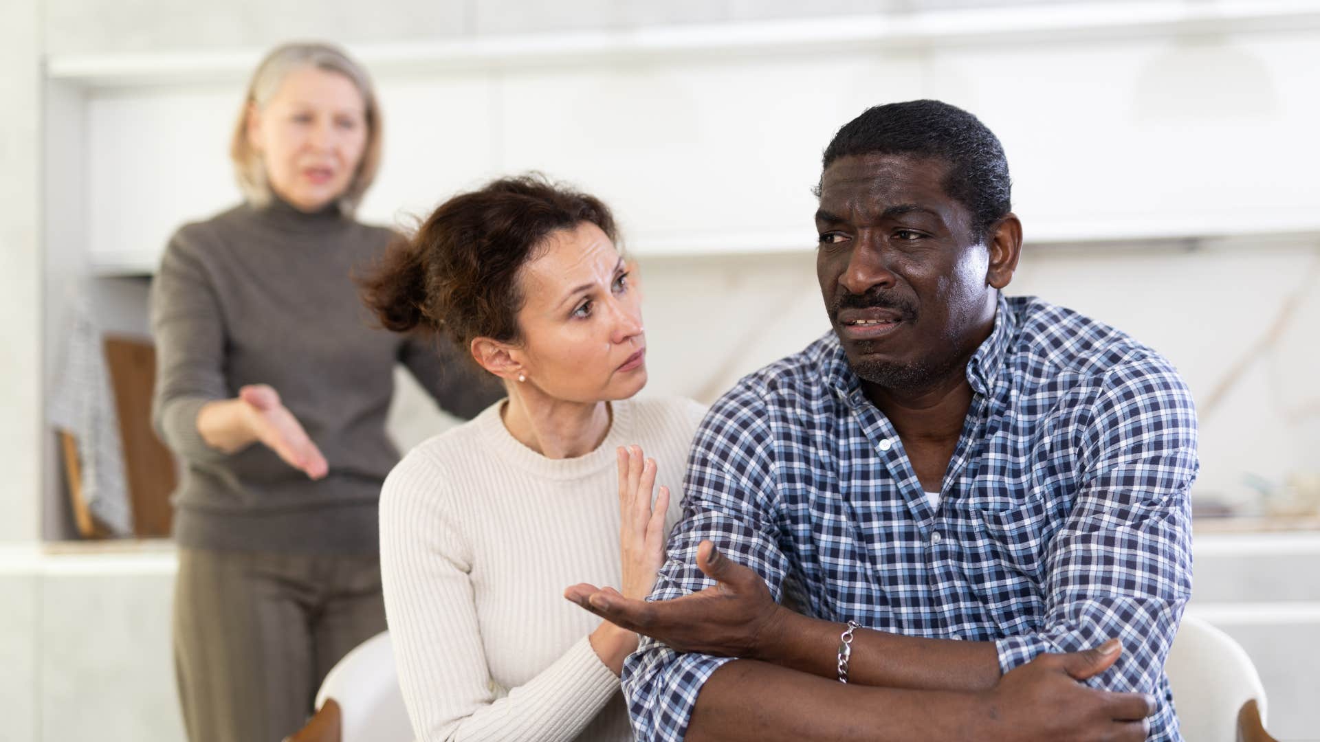woman who grew up with unpredictable hot-tempered parents acting like a peacemaker between her husband and his mom