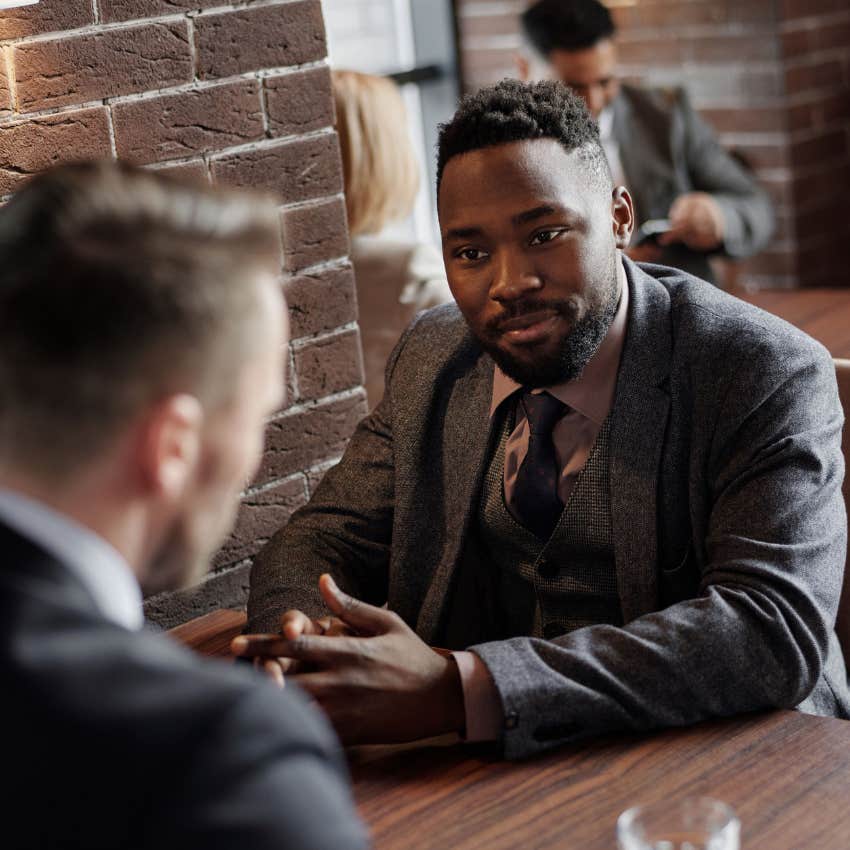 intellectually restless man having thoughtful discussion with colleague