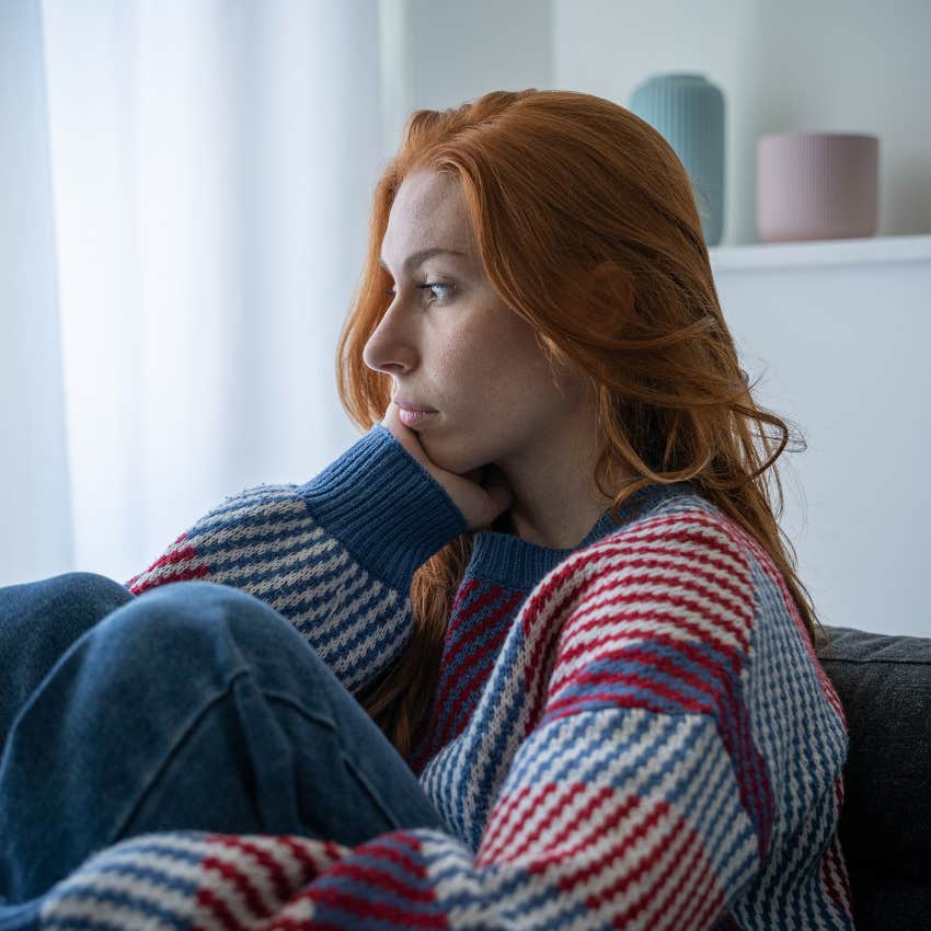 woman with red hair feeling sad and lonely slowly losing self-confidence and withdrawing socially