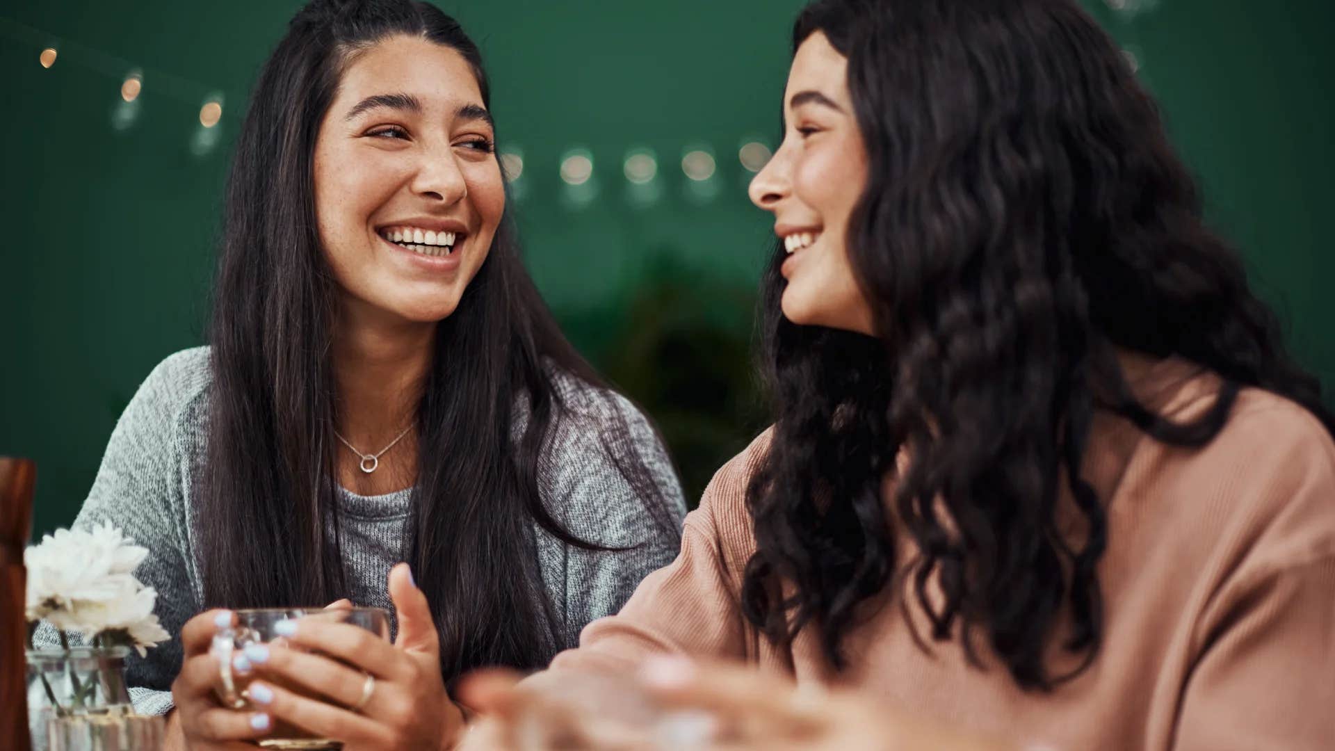 woman trying hard to impress friend by name-dropping