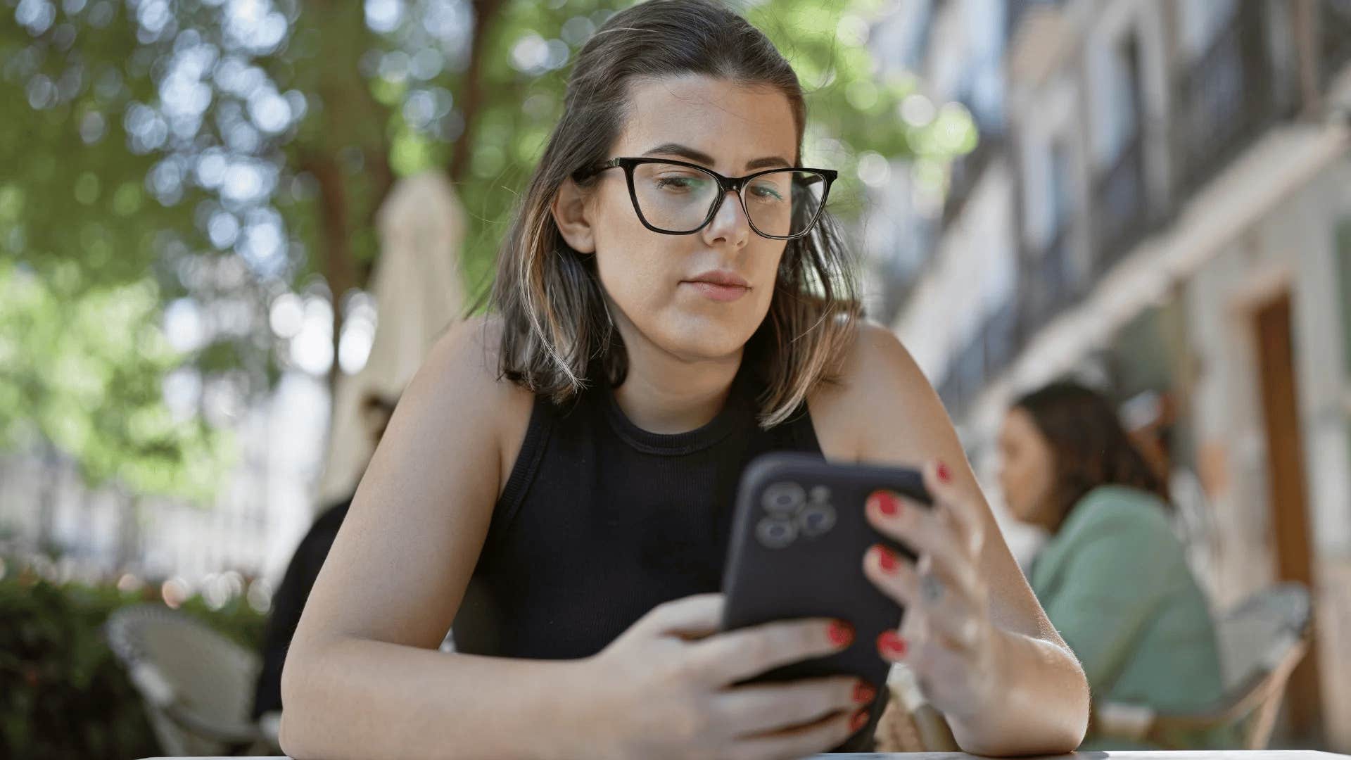 rude woman on her phone putting others down