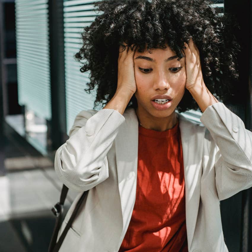 stressed woman panicking in public