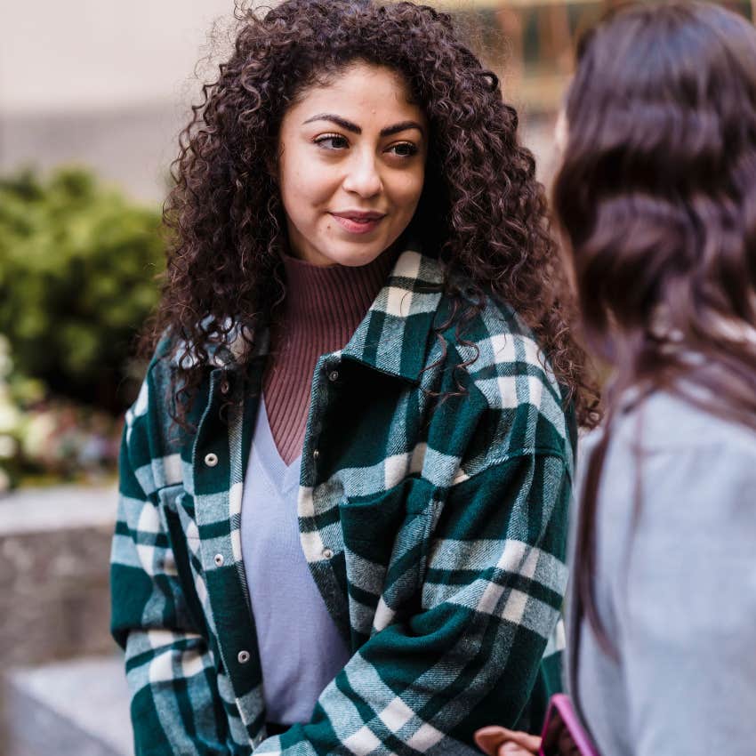 smart woman asking questions in conversation with friend