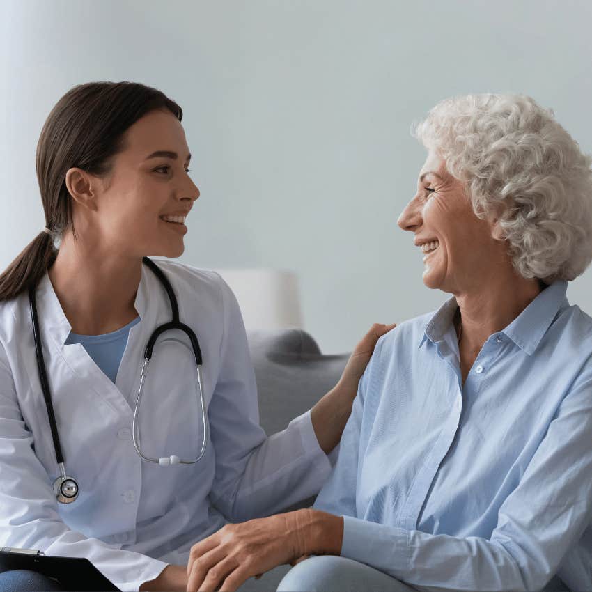 happy older woman speaking with female doctor working together
