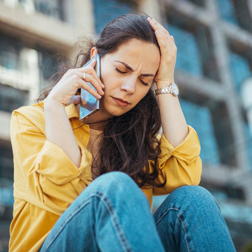 worried woman on the phone telling friend I keep replaying it in my head