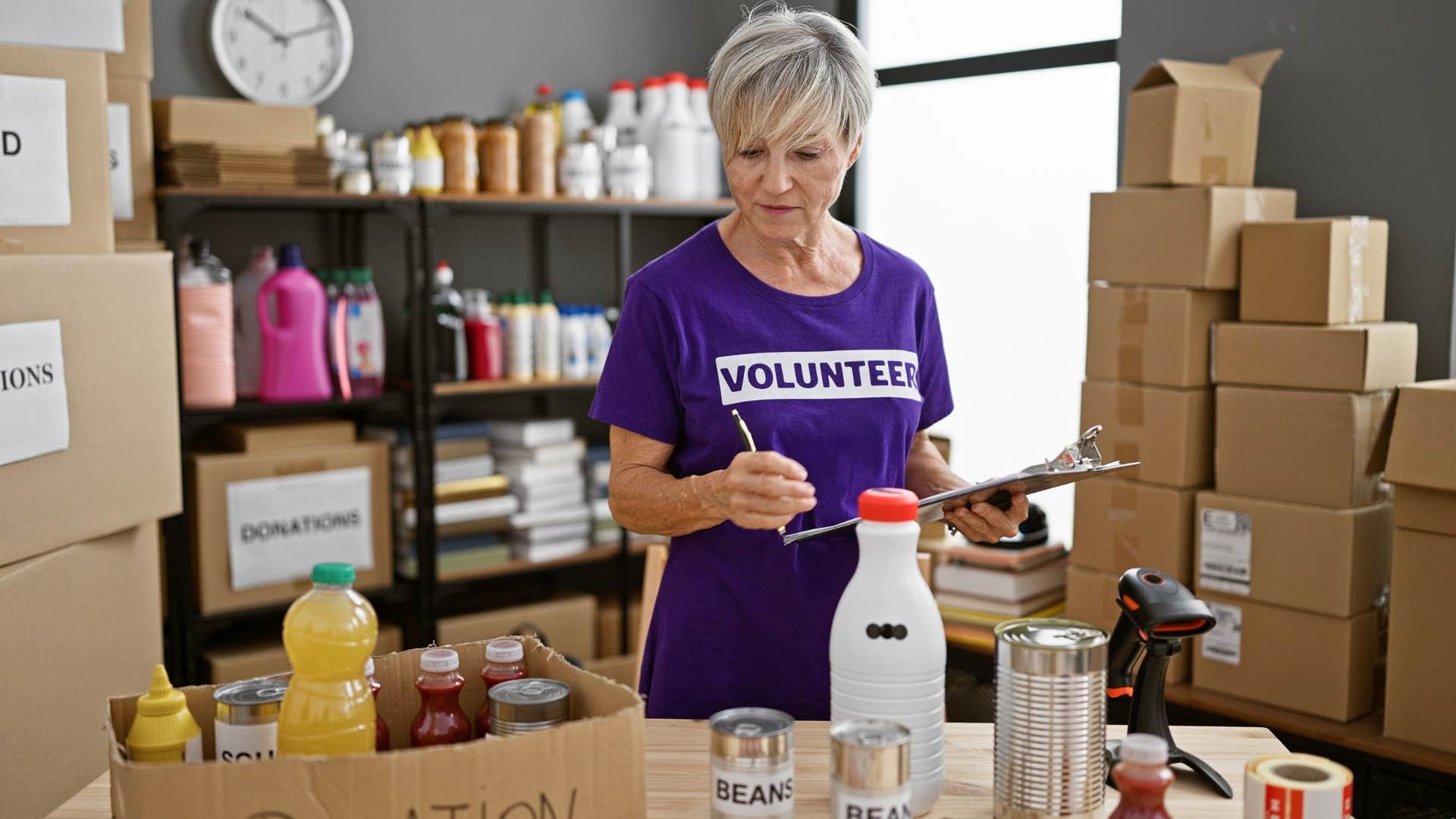retired introvert woman happily volunteering at a food drive