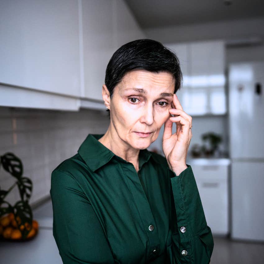 Woman who rarely asks for help sitting alone at home.