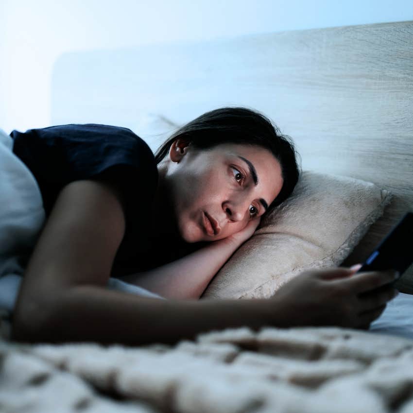 woman relying on unhealthy coping mechanisms on her phone