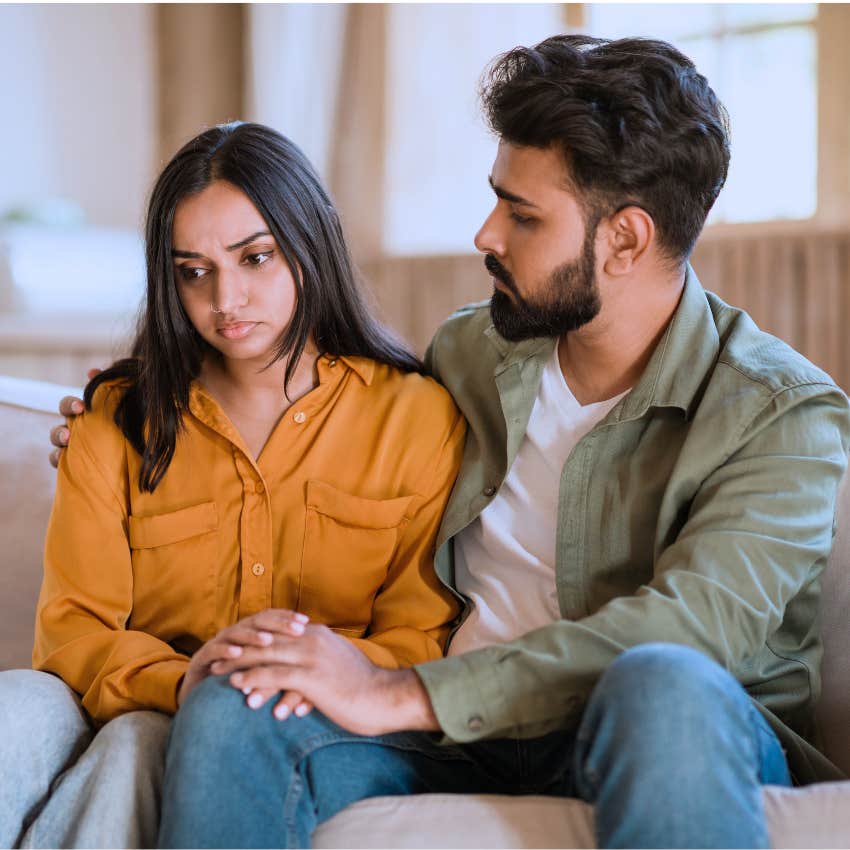 man giving his upset wife grace
