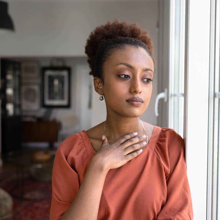 woman facing discomfort and disappointment at home