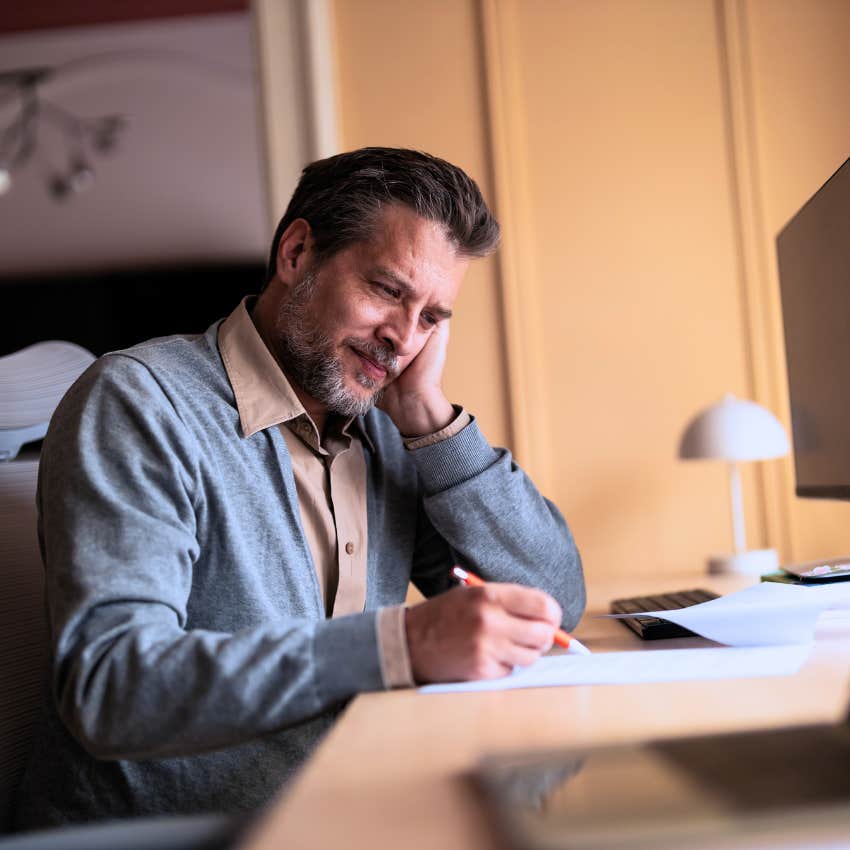 stressed man bringing work home with him