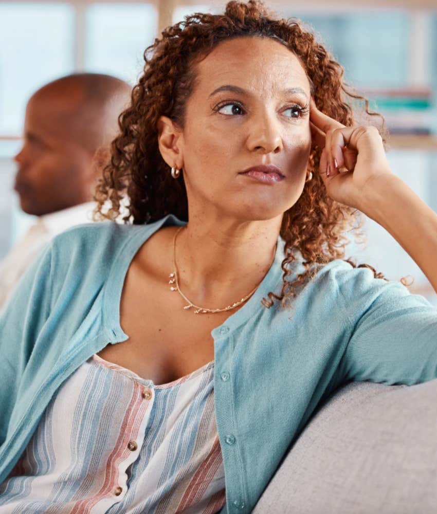 conflict avoidant woman turned away from a man and shut down