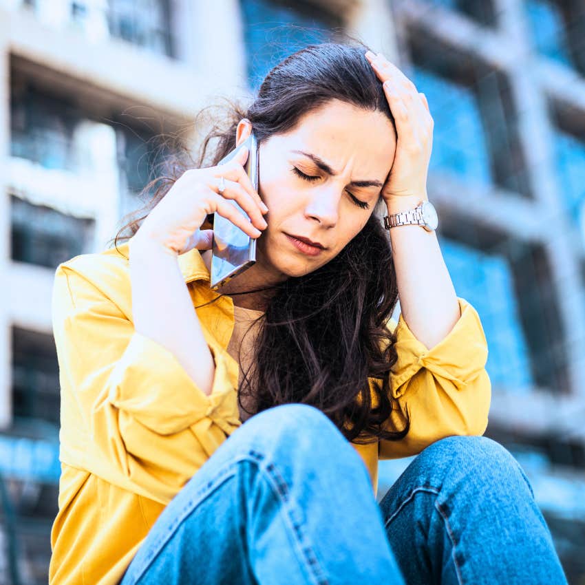 woman censoring her feelings on the phone looking sad