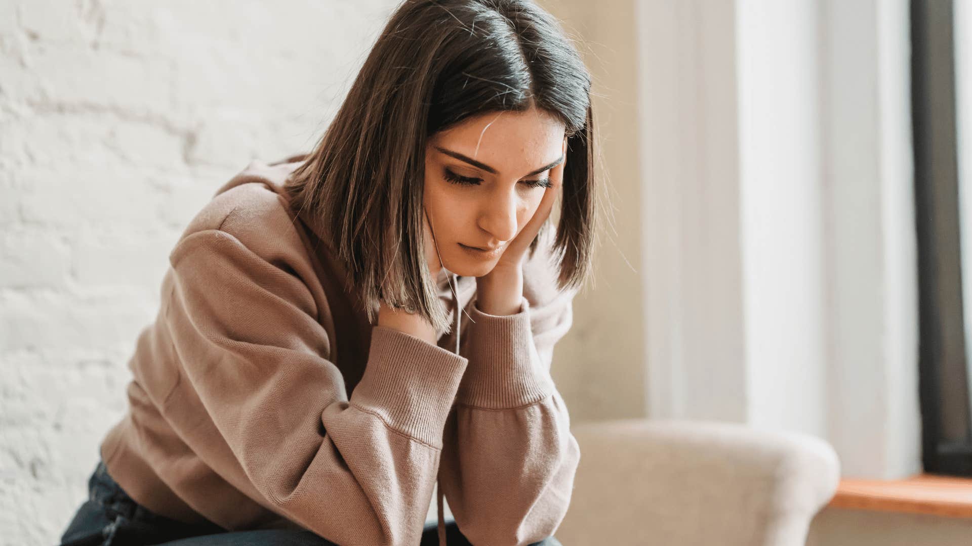 woman who had to manage her mom's bad moods struggling with her emotions