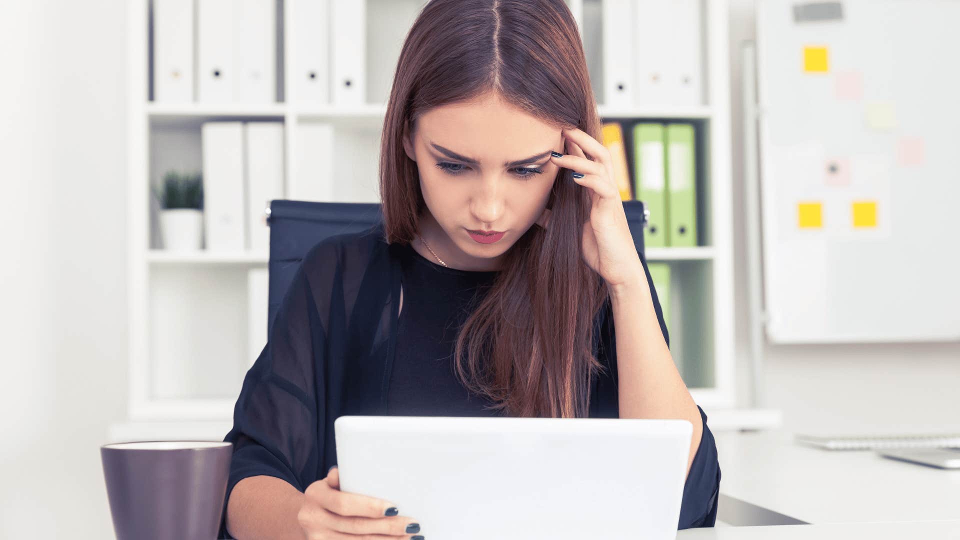 woman who had to manage her mom's bad moods struggling with her perfectionism