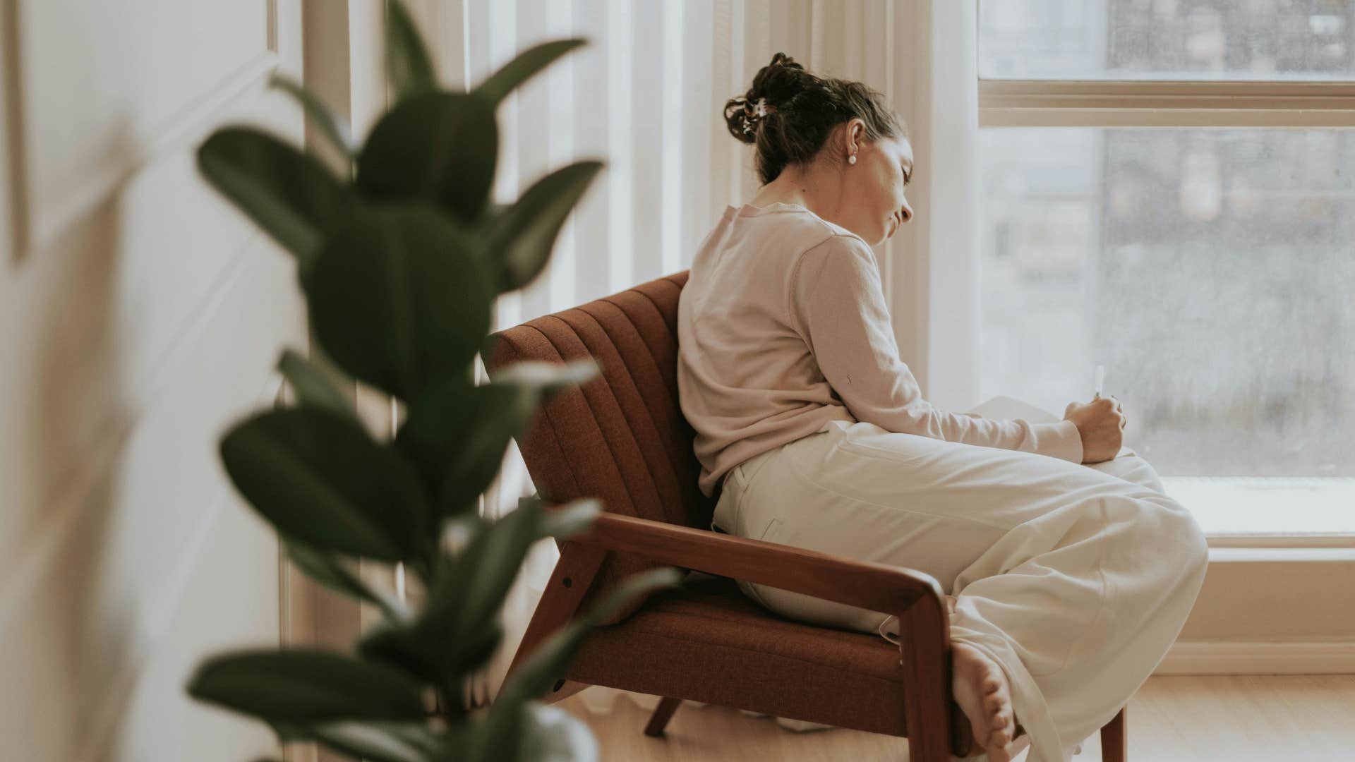 woman who had to manage her mom's bad moods struggling to relax