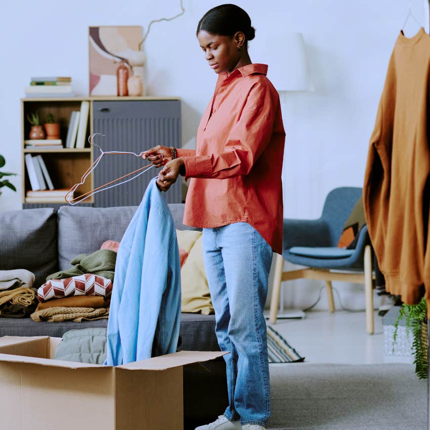 woman finding joy in organizing her closet at home