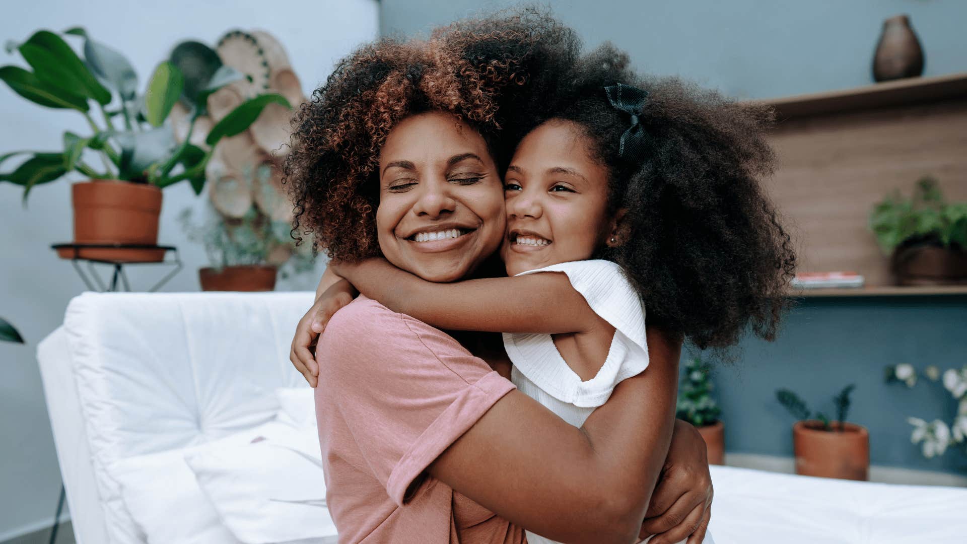 agreeable mother hugging her daughter