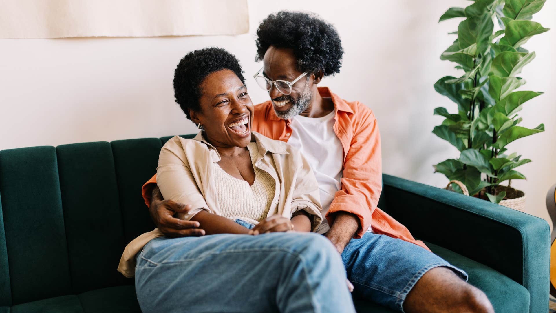 gen x couple happily in bed by 10 embracing the peace of snuggling on the couch together