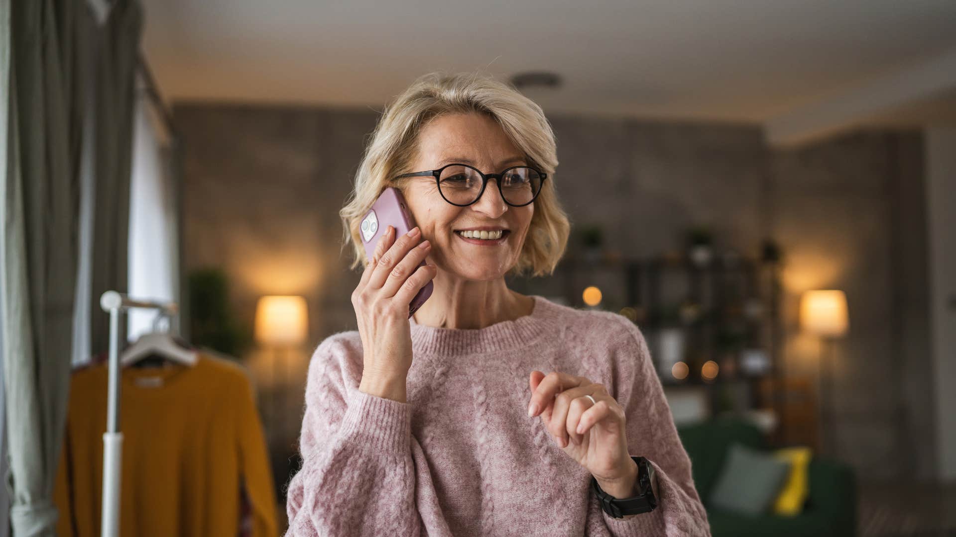 boomer woman who is happily in bed by 10 talking on the phone with friends telling them she can't go out