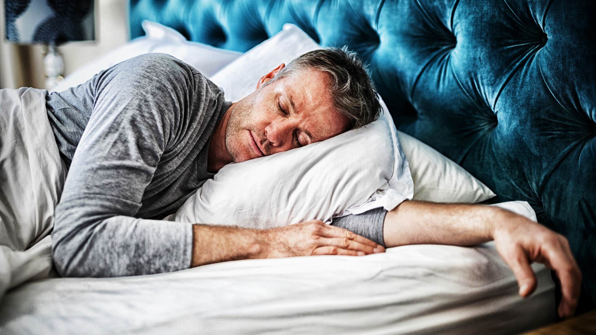 gen x man happily enjoying his early bedtime knows that sleep matters most